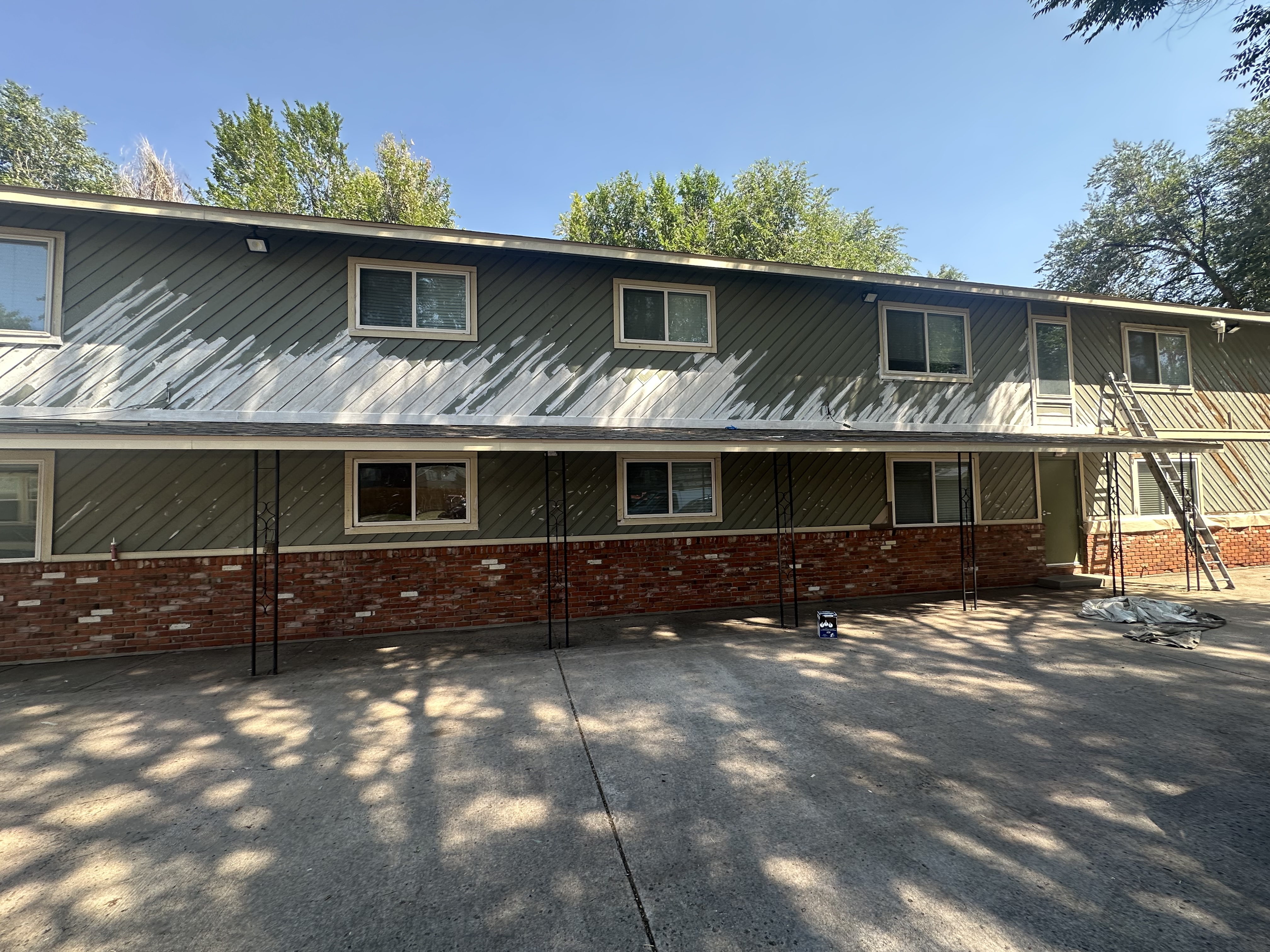 Green Siding with Brick Base - Complete Project
